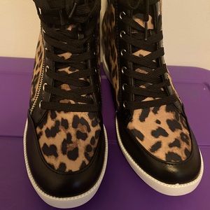 Size 9 cheetah print wedge sneakers that have never been worn.